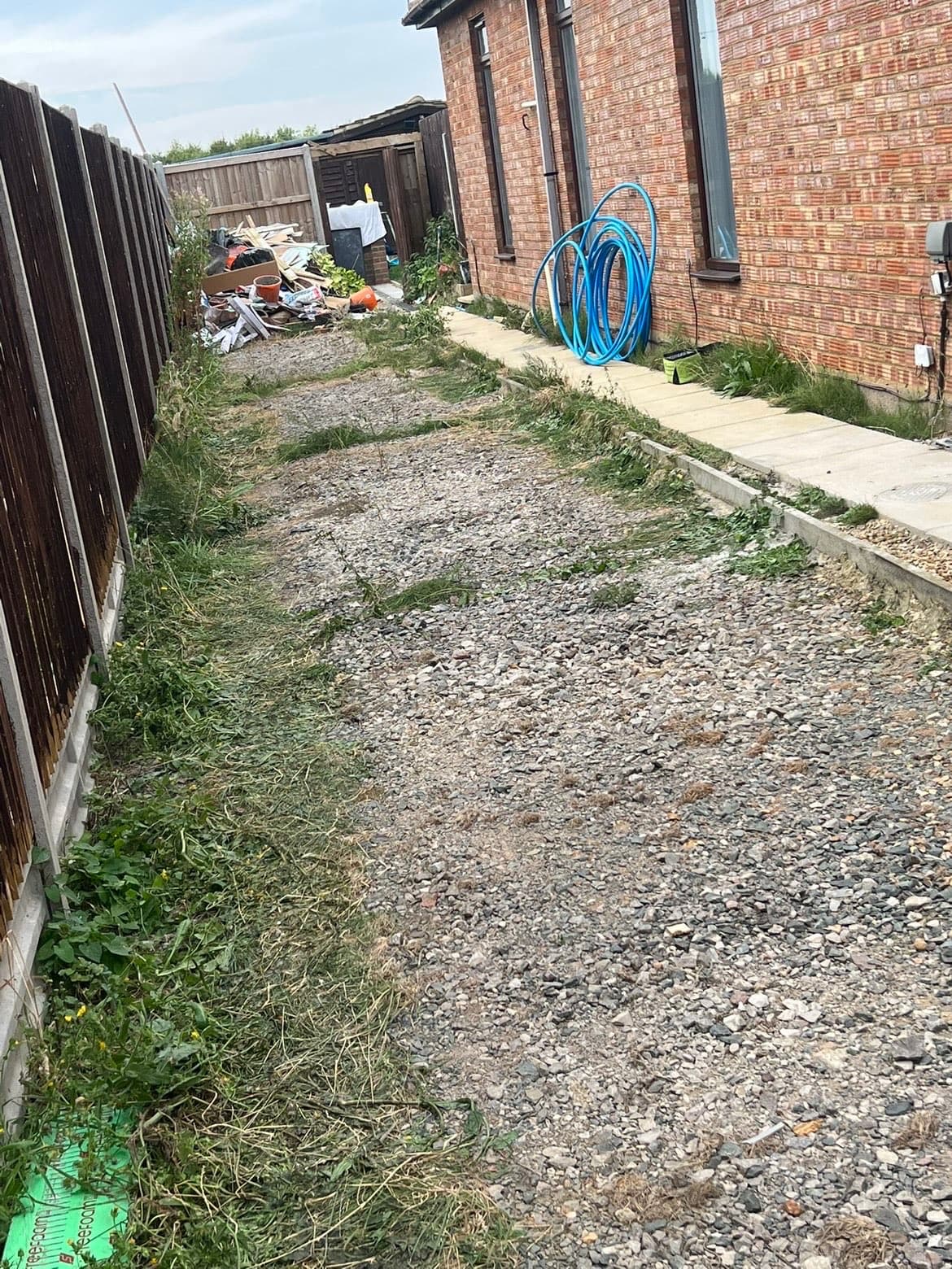 Before photo of rough side access with broken ground and overgrown edges